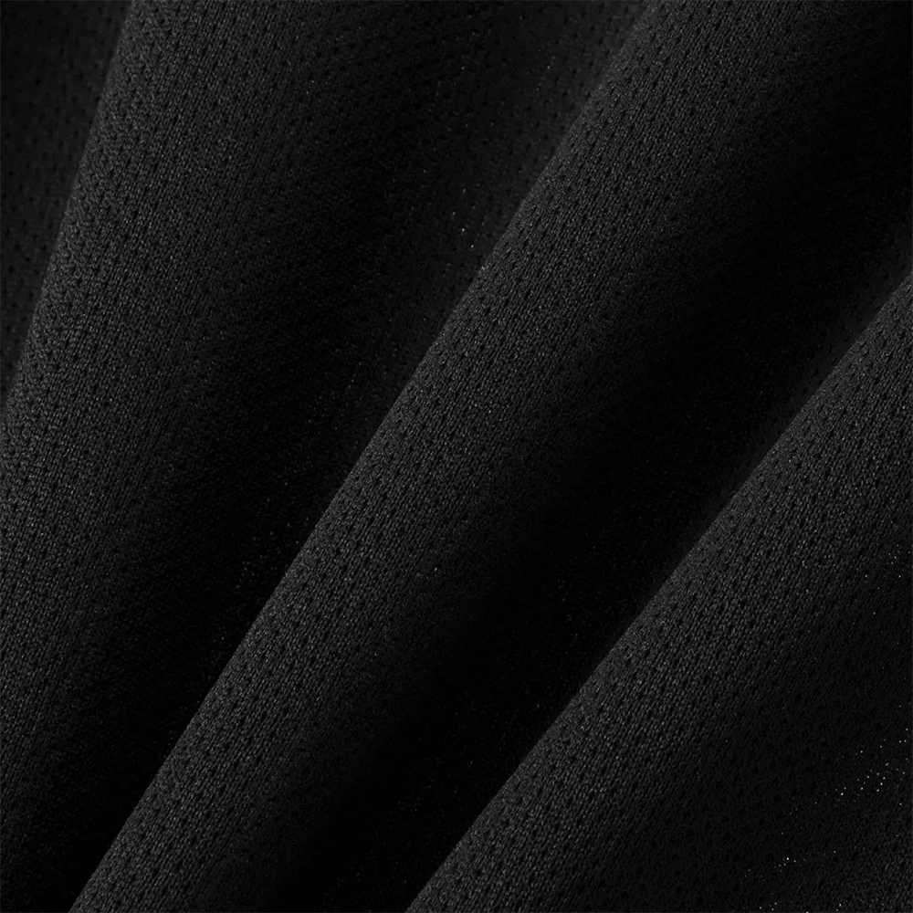 Close-up of black fabric texture of the sports long-sleeved top SF3097, showcasing breathable material for boys and girls.